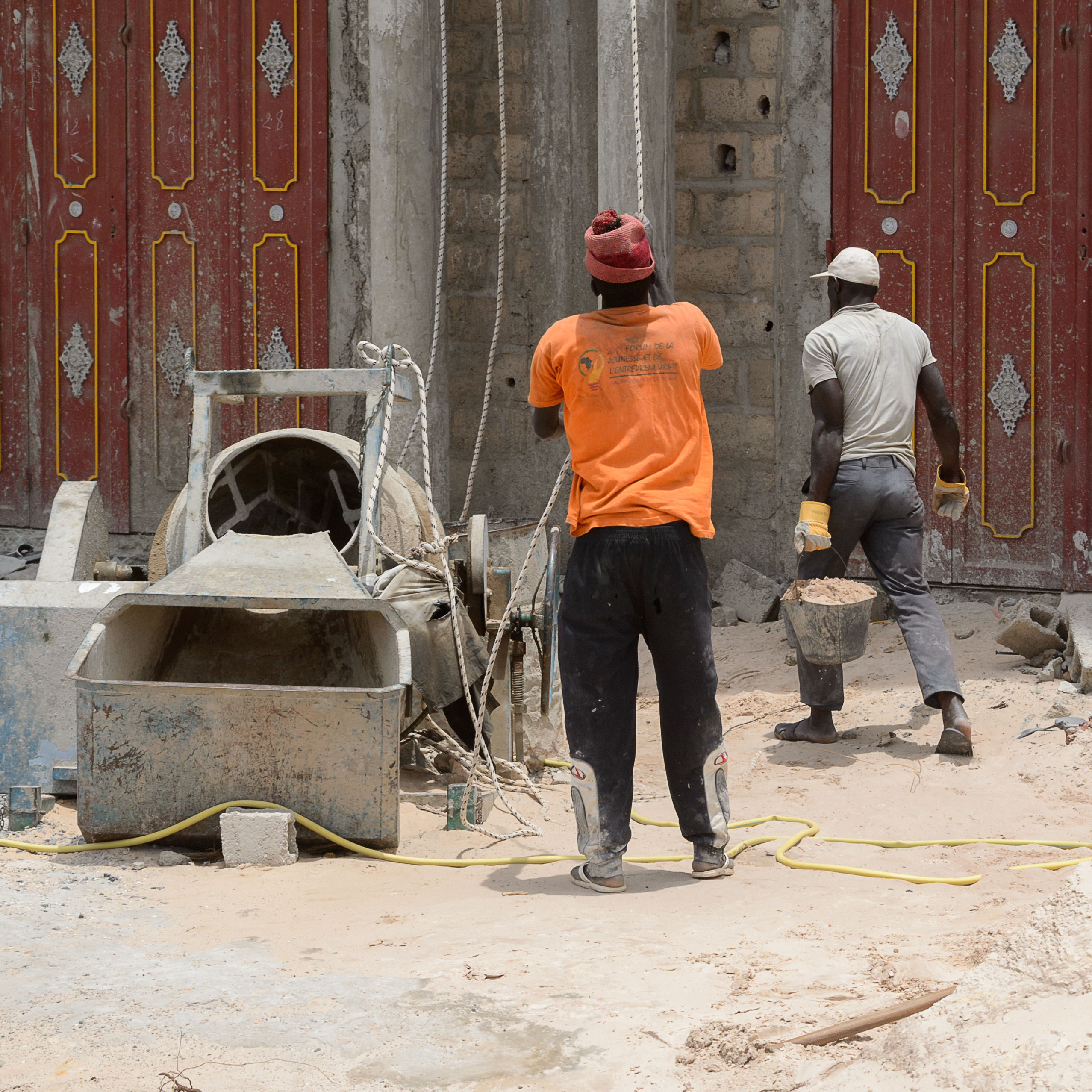Two men working on construction project