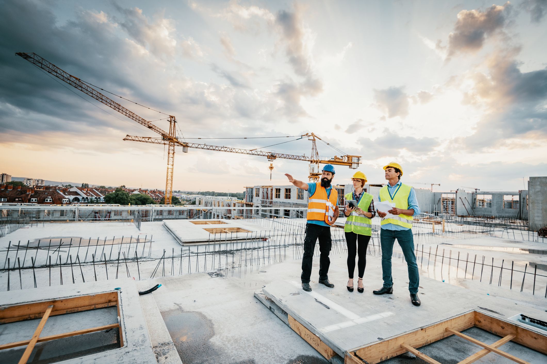 Construction team reviewing building plans