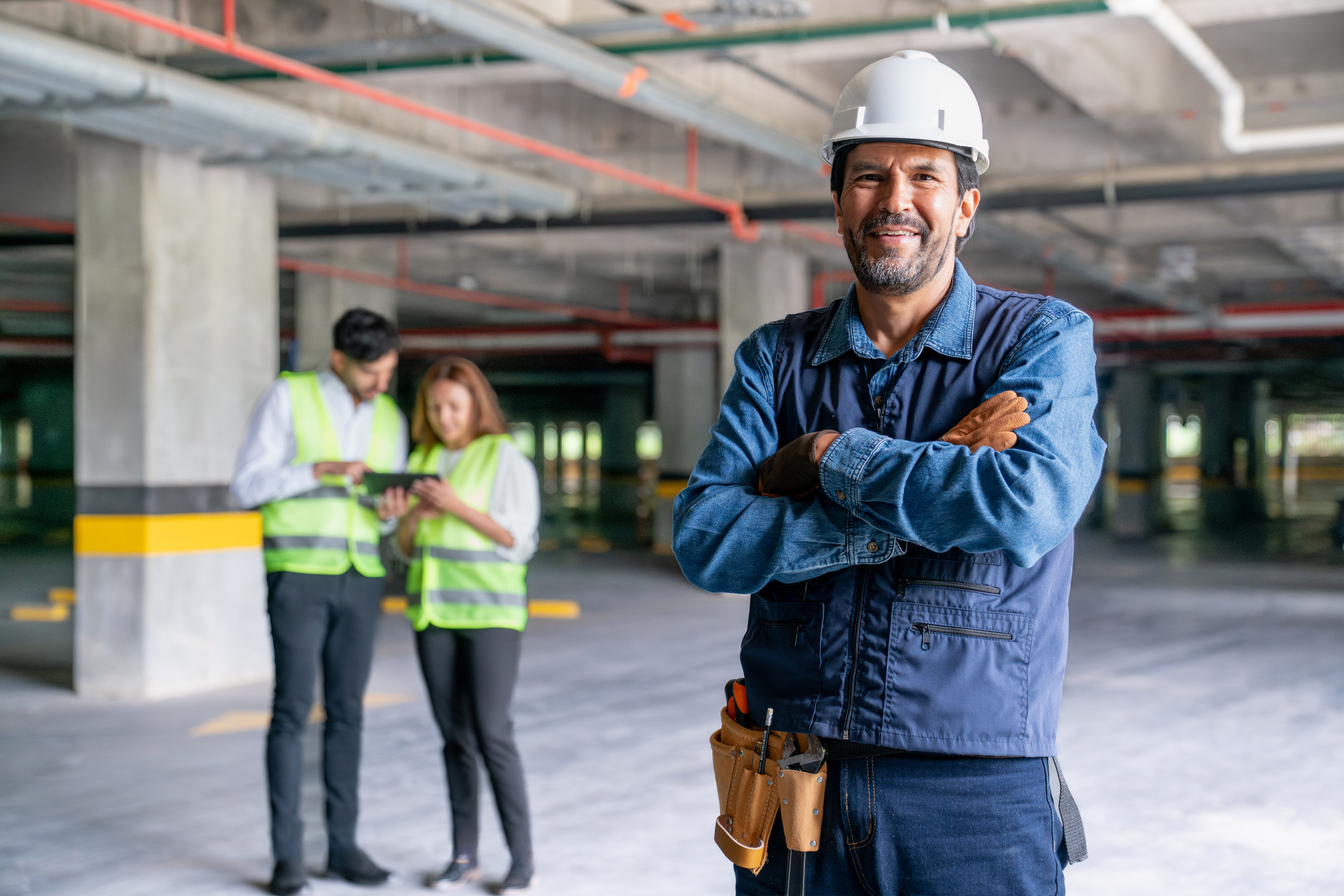 Engineer with arms crossed in construction site