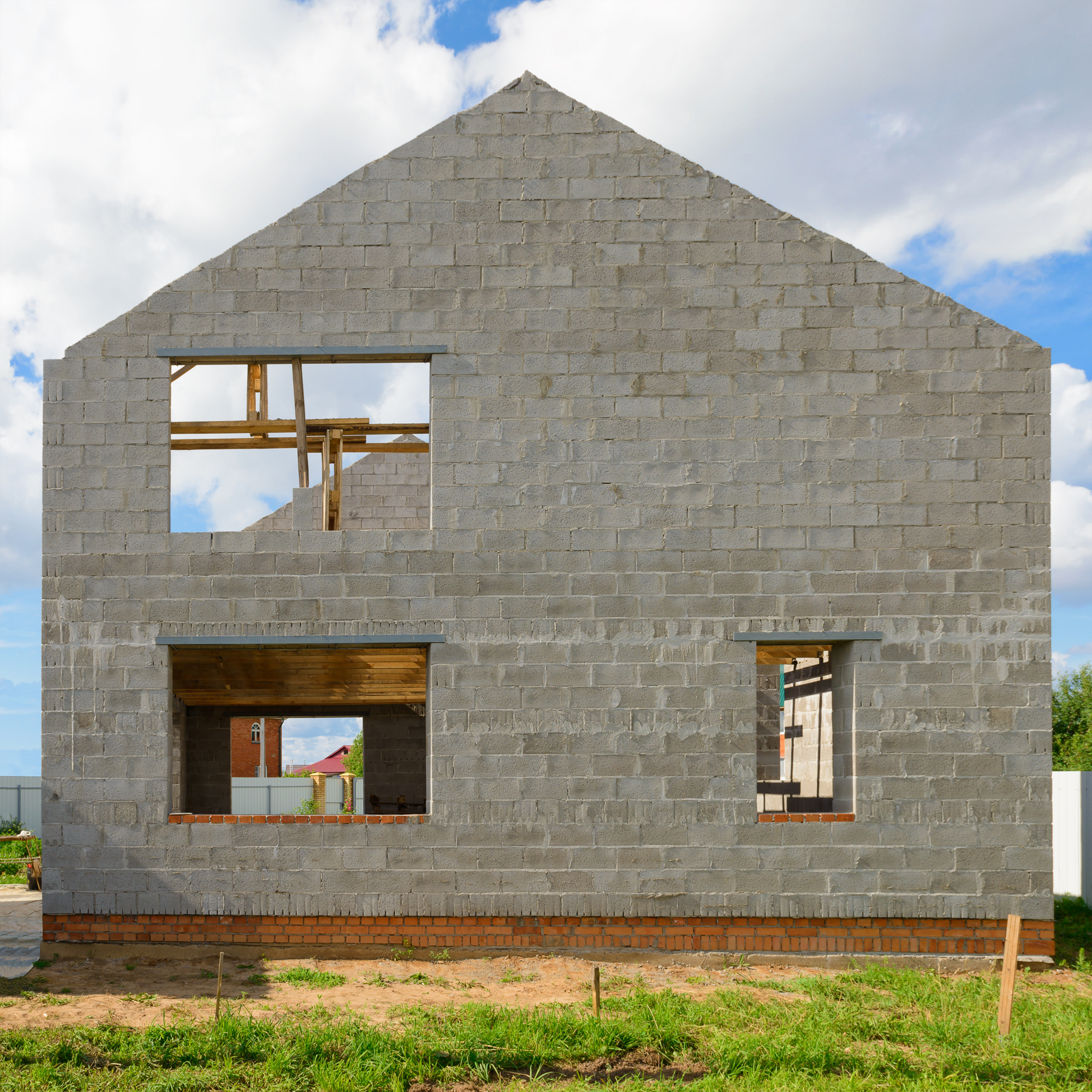 Partially built home with blue sky background