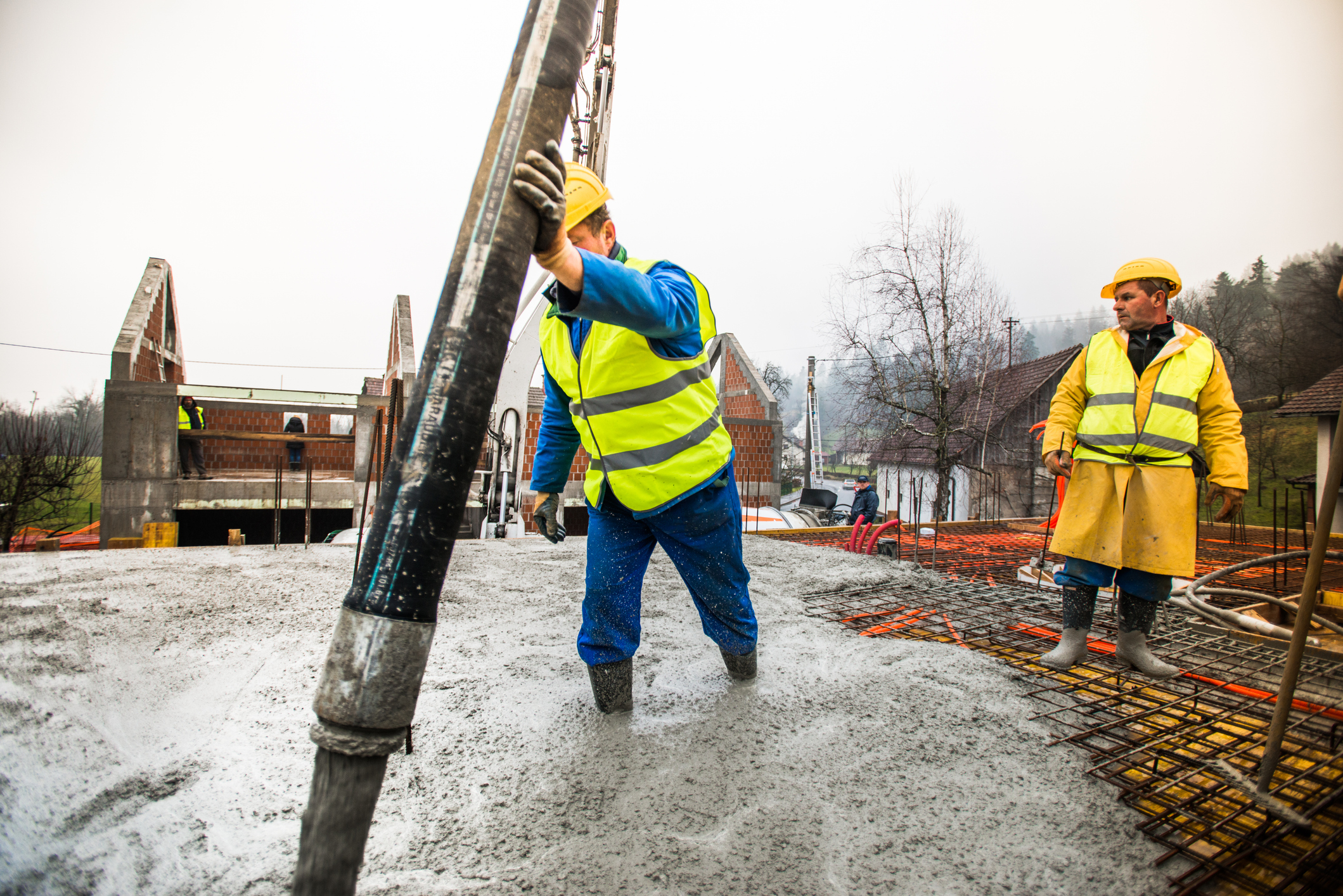 Workers wearing safety gear at construction site