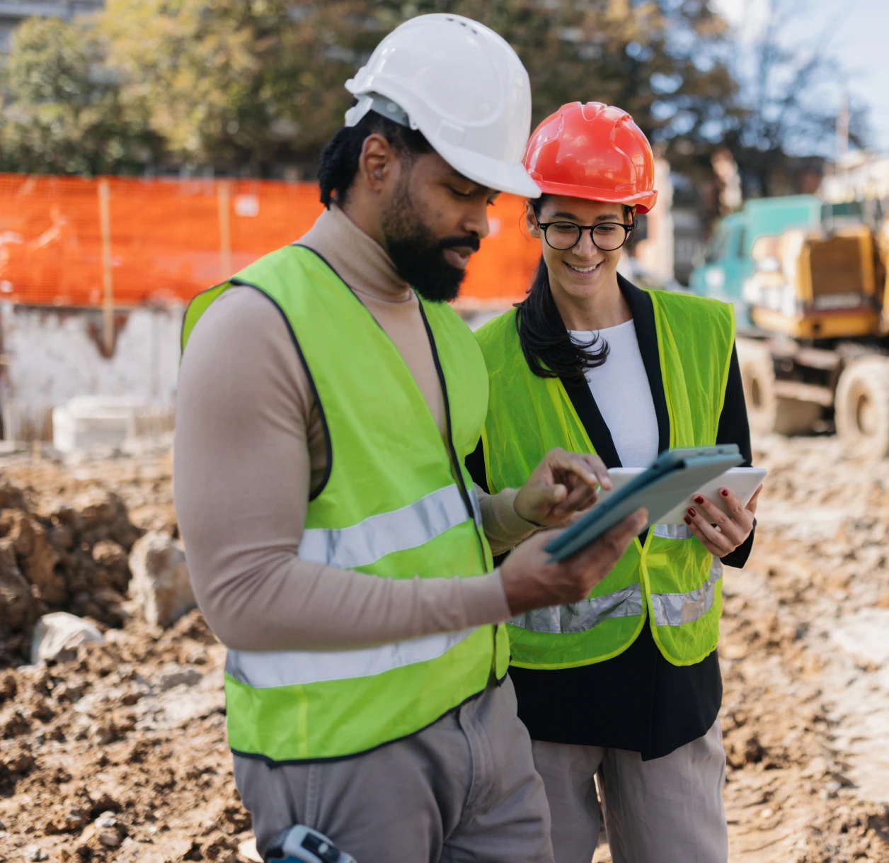 Engineers discussing project on construction site