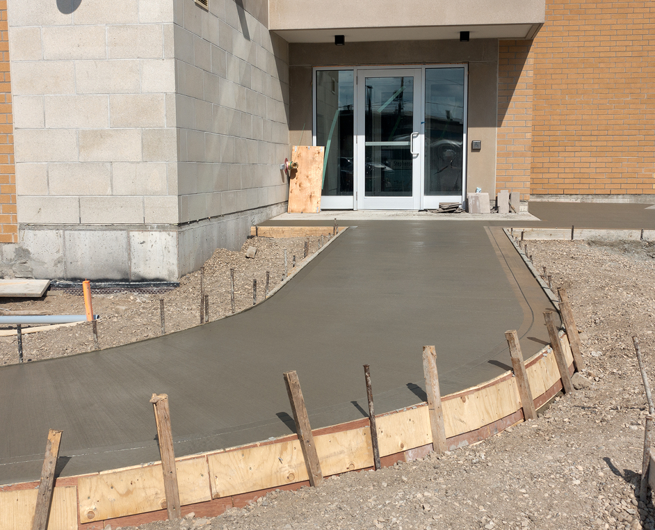 Smooth concrete sidewalk construction in progress