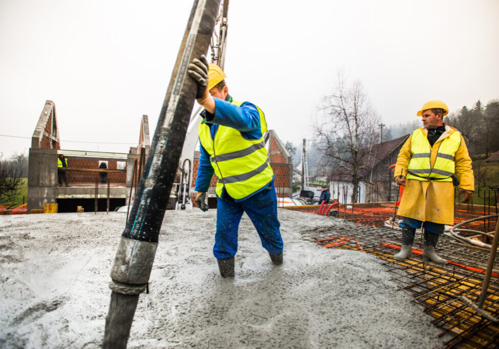 Workers wearing safety gear at construction site